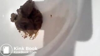 Short blond hair girl pooping on toilet