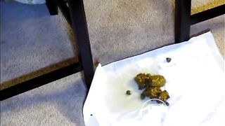 Black girl pooping between two chairs