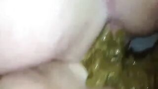 Guy fingers girls anus while she shits