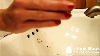 woman pooping into sink - video 2