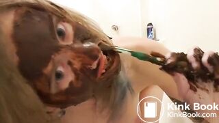 Pigtailed girl smears her face and brushes her teeth with shit