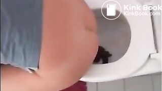 Sexy blonde girl shitting in the toilet