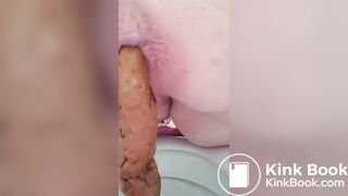 BBW girl pushing out her poop over the toilet for us