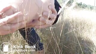 Pushing out a nice big turd in a field