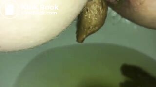 Peeing While Dropping a Firm Log into the Toilet