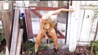 Blonde MILF shitting in the shabby courtyard