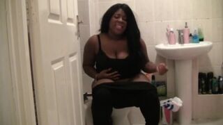 A ebony black girl shitting.