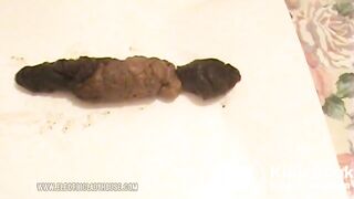 Wide turd girl pushes out a big one for us!