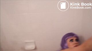 girl with purple hair makes an enema