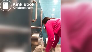 Pink shirt woman public toilet poop