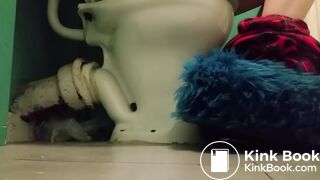 Girl with fluffy slippers pooping on the toilet