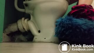 Girl with fluffy slippers pooping on the toilet