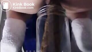 Woman pooping into jar.1