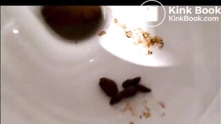 Gorgeous Italian girl is pooping on top of the toilet