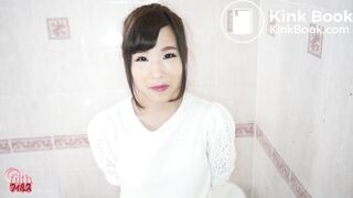Shy Japanese girl unloading in the bathtub