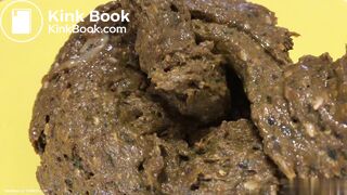 A blonde girl shit then scrutinized it.