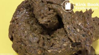 A blonde girl shit then scrutinized it.