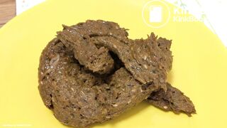 A blonde girl shit then scrutinized it.