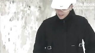 Woman pooping in the snow