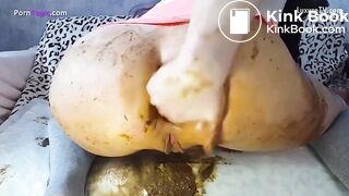 Sexy girl with a perfect ass bends over and squeezes out a big turd