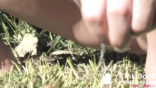 OOPS! Poops as she pees in the grass...