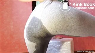 Beautiful brunette shits in grey pants