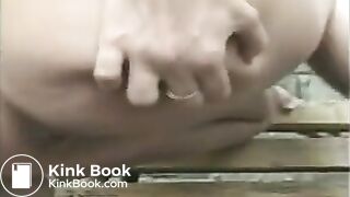 Blonde in a pink T-shirt scat on the street