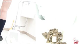 Japanese girl grimacing while shitting.