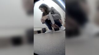 Beautiful girl having a shit and picking nose