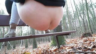 Anni pooping on a bench