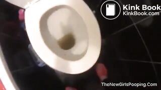 Girl having diarrhea in toilet