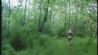 Girl in bikini shitting in the forest