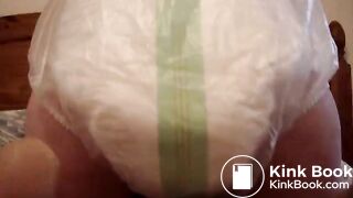 Mature woman pooping and peeing in her large diaper