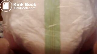 Mature woman pooping and peeing in her large diaper