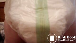 Mature woman pooping and peeing in her large diaper