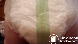 Mature woman pooping and peeing in her large diaper