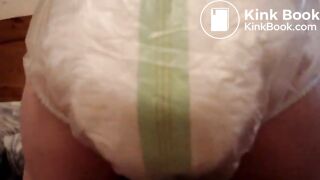 Mature woman pooping and peeing in her large diaper