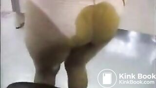 Asian woman poops her skirt.