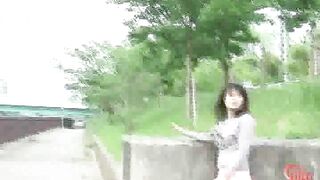 Two girls spray enema outside