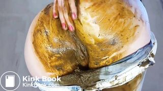 woman shits jeans and smears, puts on a show