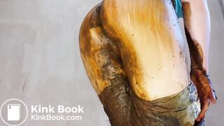 woman shits jeans and smears, puts on a show