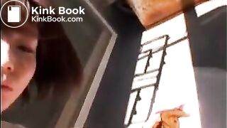 Cute asian girl sunshine shitting at balcony