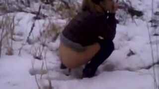 Girl poops on the snow