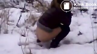Girl poops on the snow