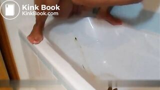 Blonde shitting and pissing inside the bathtub