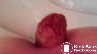 girl giving a big crap on the toilet