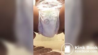 Ebony chick messes diaper