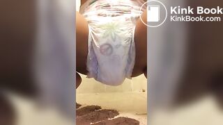 Ebony chick messes diaper