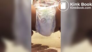 Ebony chick messes diaper