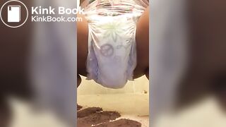 Ebony chick messes diaper